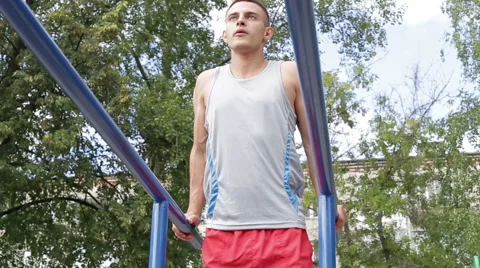 Athletic man exercising outdoors Stock Footage 65992491