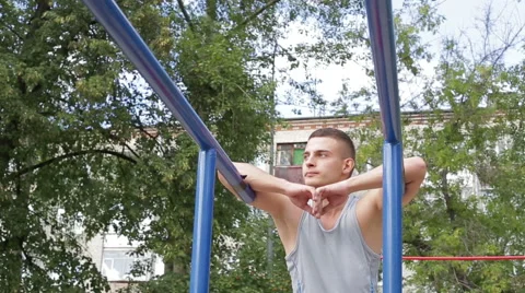 Athletic man exercising outdoors Stock Footage 65998007