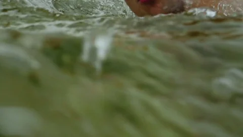 Athletic man face close up while swimming outside Video stock 83818786