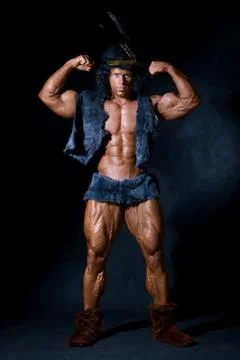 The athletic man with a feather on a head Stock Photos