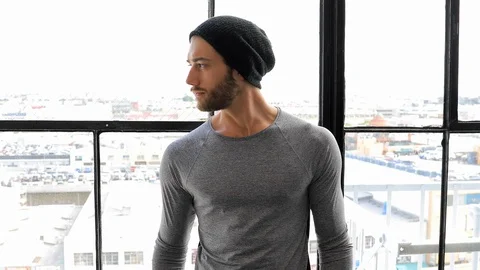 Athletic Man In Front Of Large Windows Video stock 90182646