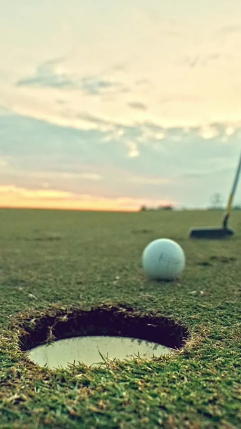 Athletic Man at Golf Course Playing Game and Hitting Ball in Hole with Club Stock Footage 335430311