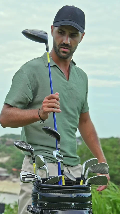 Athletic Man at Golf Course Playing Game with Ball in Nature Taking Club of Bag Stock Footage 336150959