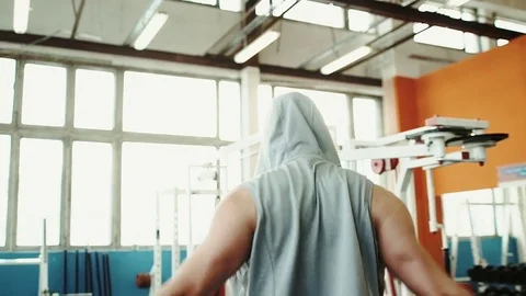 Athletic man in the gym doing stretches to prepare for his workout Stock Footage 72028153