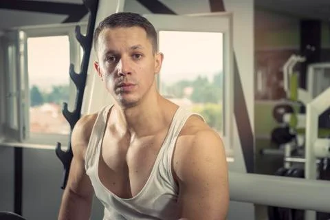 Athletic man in the gym Stock Photos