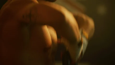 Athletic man lifting a kettlebell Stock Footage 100037055