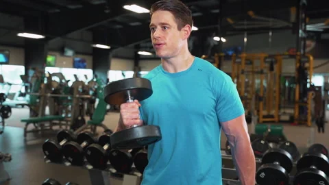 Athletic Man Lifting Weights At Gym | Slow Motion Stock Footage 167285114