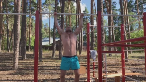 athletic man with a naked torso doing pu... | Stock Video | Pond5