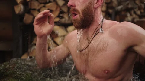 Athletic Man Plunging In Pot With Cold Water After Sauna, Contrast Of Stock Footage 246389204