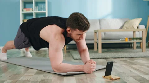 Athletic Man Practices Planks Stock-Footage 138512435
