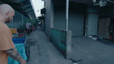 Athletic Man Practicing Parkour in Slum Area Stock Footage 242097556