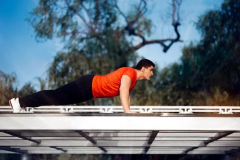 Athletic Man in Push-up Plank Position Training Stock Photos
