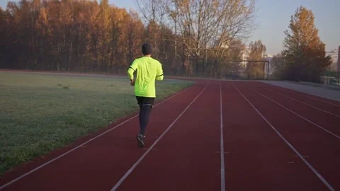 Athletic Man runner running on stadium track. Stock Footage 151046016