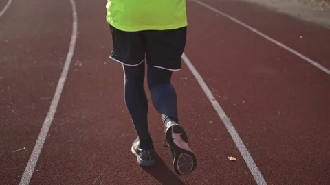 Athletic Man runner running on stadium track. Stock Footage 151198077