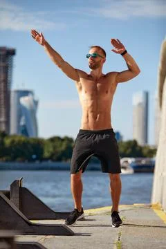 Athletic man running and doing functional workout outdoors - Sportive adult male Foto stock