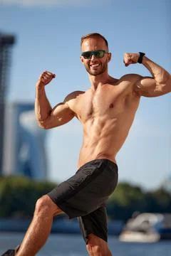 Athletic man running and doing functional workout outdoors - Sportive adult male 写真素材