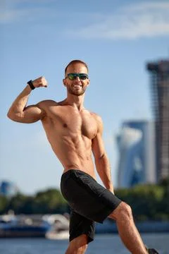 Athletic man running and doing functional workout outdoors - Sportive adult male Foto stock