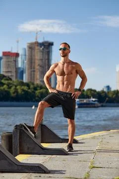 Athletic man running and doing functional workout outdoors - Sportive adult male Foto stock