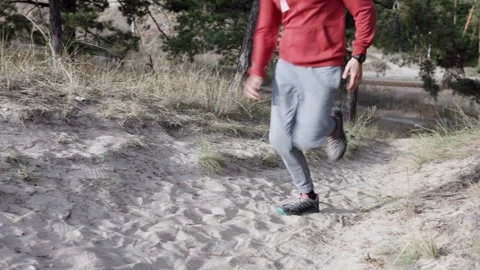 Athletic man running in nature. Concept of willpower and motivation. Stock Footage 314653802