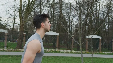 Athletic man running outdoors Stock Footage 100030491
