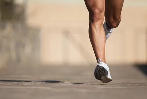 Athletic man running in the road Foto stock