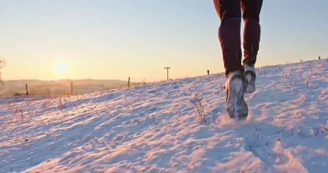 Athletic man Is Running Through The Snow - slow motion Stock Footage 146535861