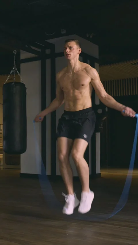 Athletic man skipping with a jump rope Stock Footage 226538333
