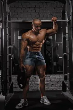 Athletic Man at the Smith's Gym Stock Photos