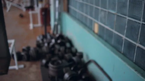 Athletic man taking dumbbells Video stock 64317609