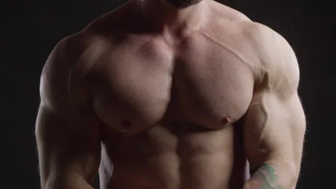 Athletic man tensing his pectoral muscles Stock Footage 172152115
