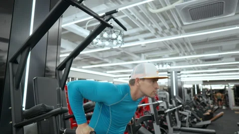 Athletic man train lower chest doing parallel bar dips exercise in gym Video stock 254574251
