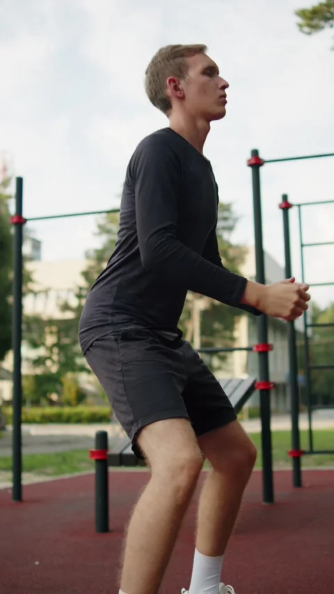 Athletic man training leg muscles and glutes with classic squats during. Yo.. Stock Footage 341728283