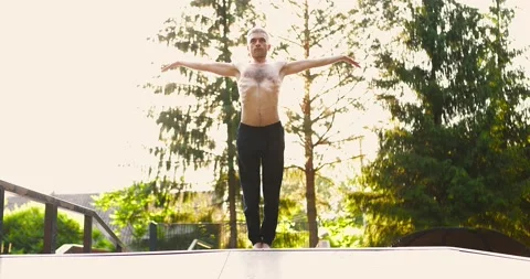 Athletic man training yoga pose and doing yoga breathing exercise while raising 스톡 동영상 158120731