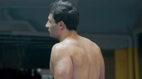 Athletic man walking past camera Stock Footage 181830663