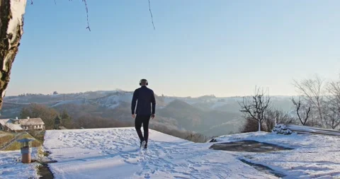 Athletic man Is walking Through The Snow - slow motion Stock Footage 146539983