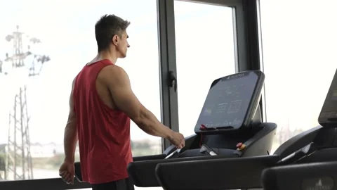 Athletic Man Walking On Treadmill In Gym Stock Footage 201403328