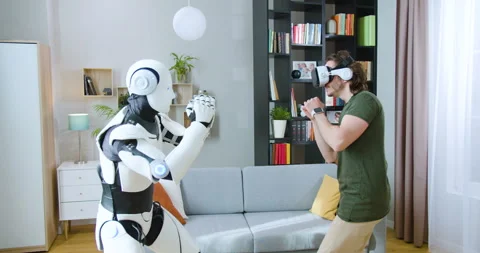 Athletic man wearing virtual reality headset and making fighting moves with Stock Footage 244137995