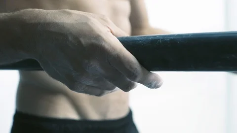 Athletic man working out on dip bars at the gym Stock Footage 127437041