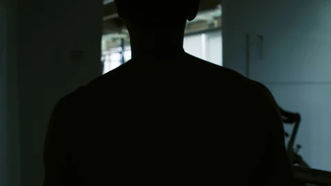 Athletic man working out on dip bars at the gym Stock Footage 127437178