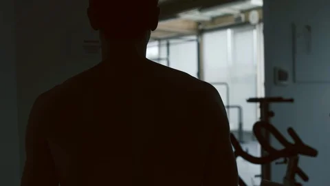 Athletic man working out at the gym and doing pull-ups Stock Footage 127435914