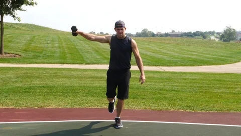 Athletic man working out training exercising balance side raises, 4k, 60fps. Stock Footage 115914471