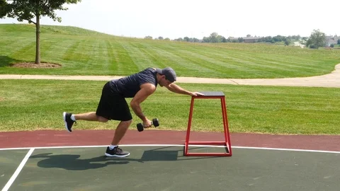 Athletic man working out training exercising row to kickback, 4k, 60fps. Stock Footage 116146599