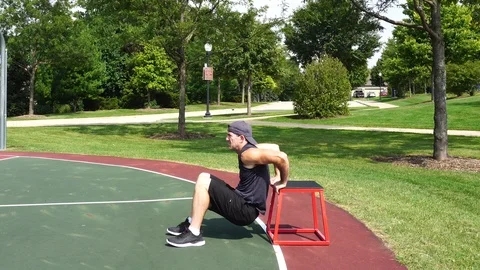 Athletic man working out training exercising chair triceps dips, 4k. Stock Footage 116146621