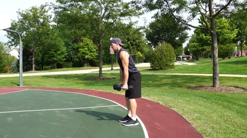 Athletic man working out training exercising dumbbell dead lifts 4k. Stock Footage 116147468