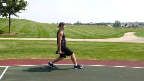 Athletic man working out training exercising, lunge biceps curls, 4k, 60fps. Stock Footage 116147759