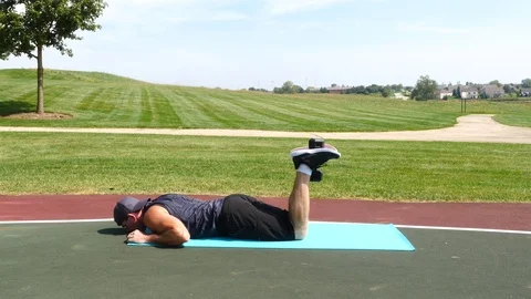 Athletic man working out training exercising, dumbbell leg curls, 4k, 60fps. Stock Footage 116148044