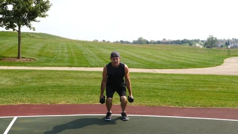 Athletic man working out training exercising squats, biceps curls, 4k, 60fps. Stock Footage 116149201