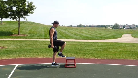 Athletic man working out training exercising step up curls, 4k, 60fps. Stock Footage 116149253
