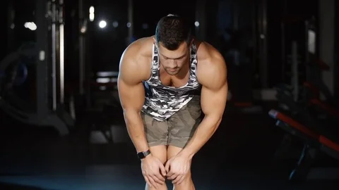 Athletic man workout and trains leg joins knees circle exercise Video stock 80488070