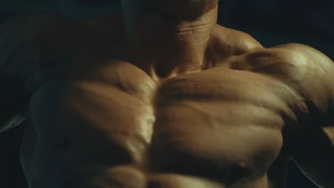 Athletic men pumping up muscles push-ups on uneven bars Video stock 118776038